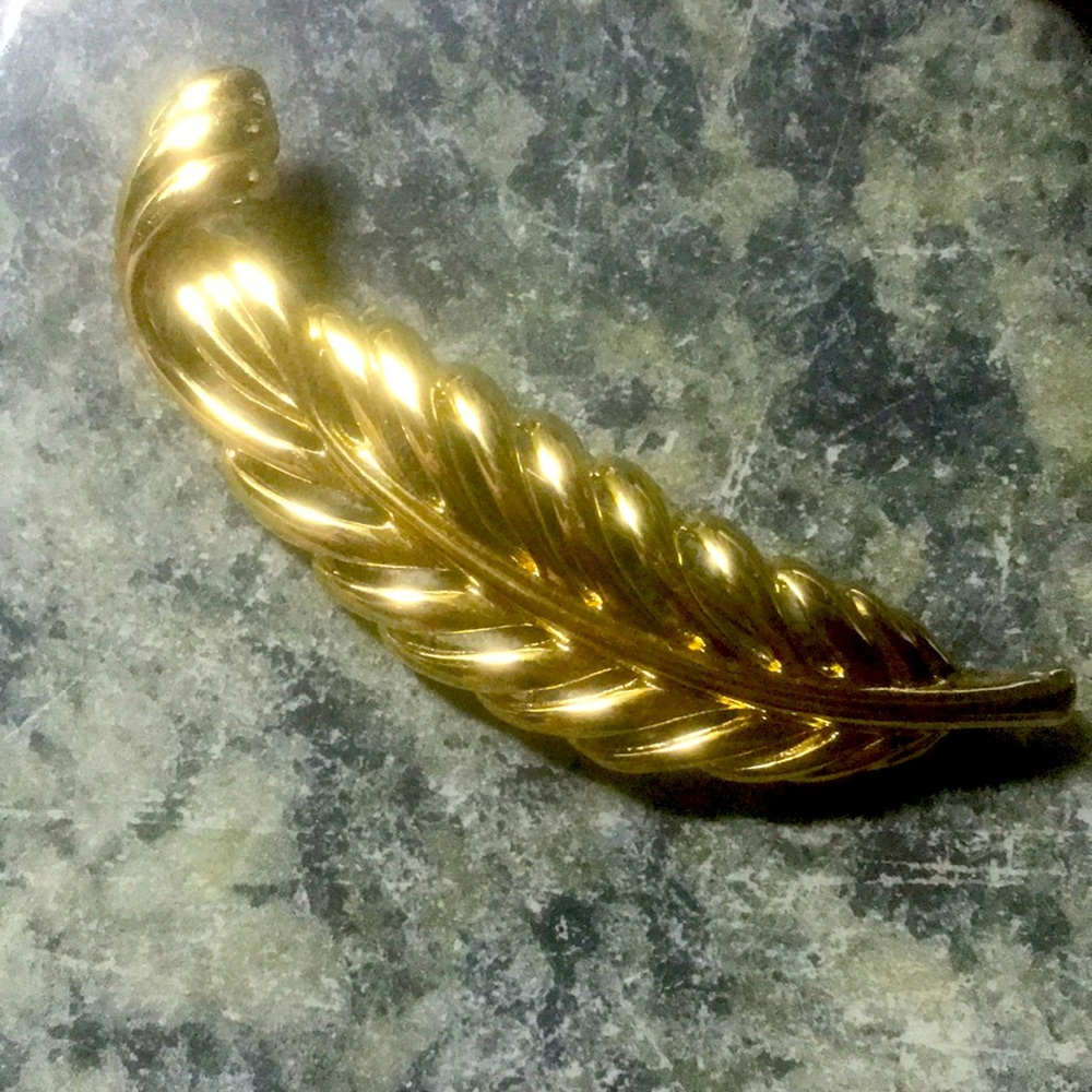 Napier gold tone feather brooch